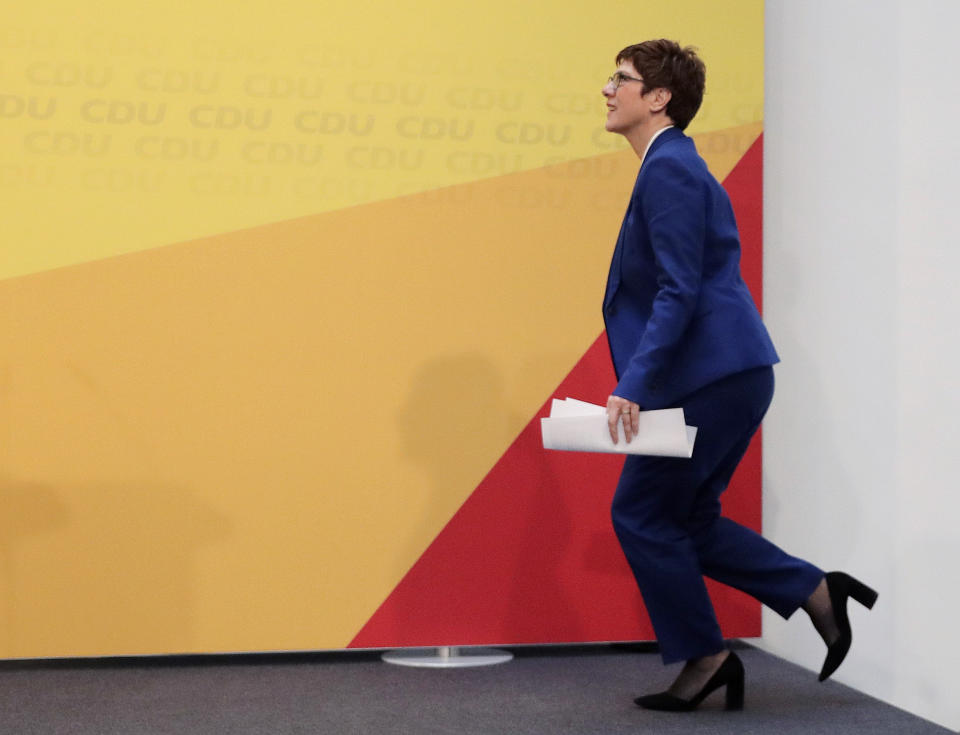 Christian Democratic Union party (CDU) chairwoman and Defense Minister Annegret Kramp-Karrenbauer enters the stage for a press conference in Berlin, Germany, Monday, Feb. 10, 2020. Angela Merkel's designated successor Annegret Kramp-Karrenbauer will quit her role as head of the Germany's strongest party in summer and won't stand for the chancellorship.(AP Photo/Markus Schreiber)
