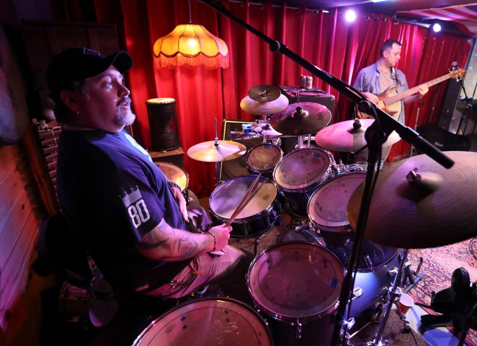 Donny Merrill, drummer and chef/owner of Newark-area Skipjack Dining (left) and members of the band Grinch rehearse for a concert benefitting Merrill's daughter Mickey in 2018.