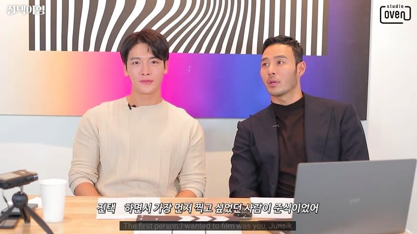 Jin-taek says, "The first person I wanted to film was you, Jun-sik," as Jun-sik sits next to him