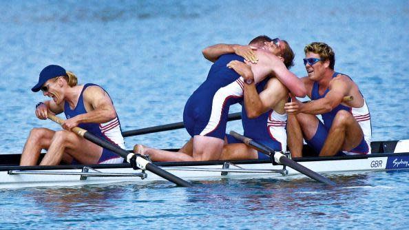 Sir Steve Redgrave is hugged by team-mate Matthew Pinsent in the boat as the GB crew won the gold medal in the Olympic mens coxless four final.