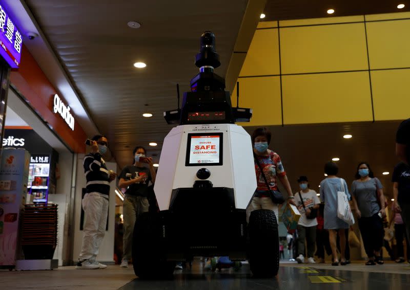 Autonomous robot Xavier patrols a neighbourhood mall to detect "undesirable social behaviours" during a three-week trial in Singapore