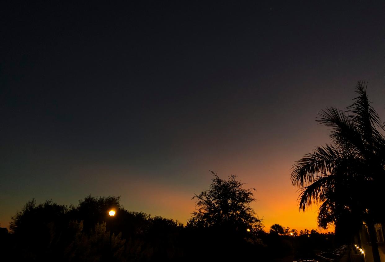 The setting sun's last rays cast a warm glow in North Naples.