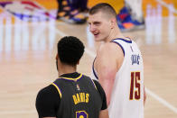 Los Angeles Lakers forward Anthony Davis, left, talks with Denver Nuggets center Nikola Jokic after an NBA basketball game Monday, May 3, 2021, in Los Angeles. (AP Photo/Mark J. Terrill)