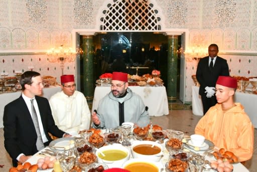 Moroccan King Mohammed VI (C) and his son Crown Prince Moulay Hassan (R) share an iftar meal with US President Donald Trump's son-in-law and adviser Jared Kushner at the Royal Residence in Rabat on May 28, 2019