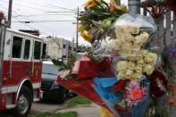 A sidewalk memorial is seen near the burned warehouse following the fatal fire in the Fruitvale district of Oakland, California, U.S. December 5, 2016. REUTERS/Lucy Nicholson