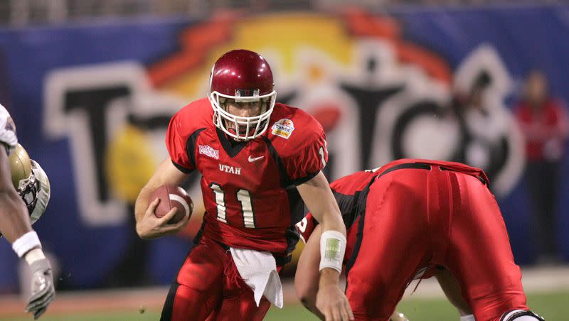 Utah quarterback Alex Smith runs through the Pitt Panthers defense during the 2005 Fiesta Bowl in Tempe, Ariz. on Jan. 1, 2005.