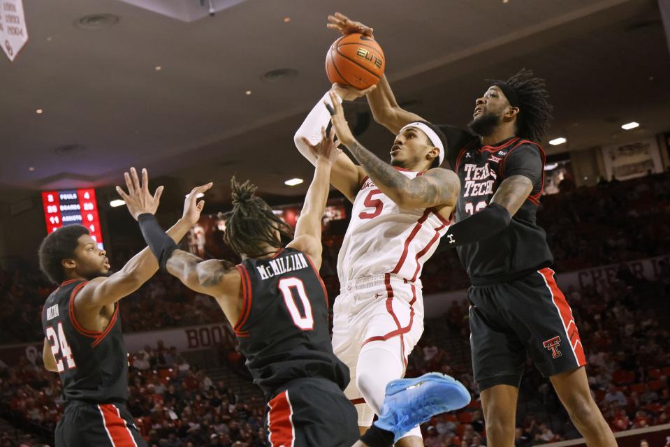 Texas Tech forward Warren Washington, right, blocks a shot-attempt by Oklahoma guard Rivaldo Soares (5) Saturday, Jan. 27, 2024, in Norman, Okla.