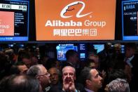 Traders work on the floor as they wait for a final price on the Alibaba Group Holding Ltd. initial public offering (IPO) under the ticker "BABA", at the New York Stock Exchange in New York September 19, 2014. REUTERS/Lucas Jackson