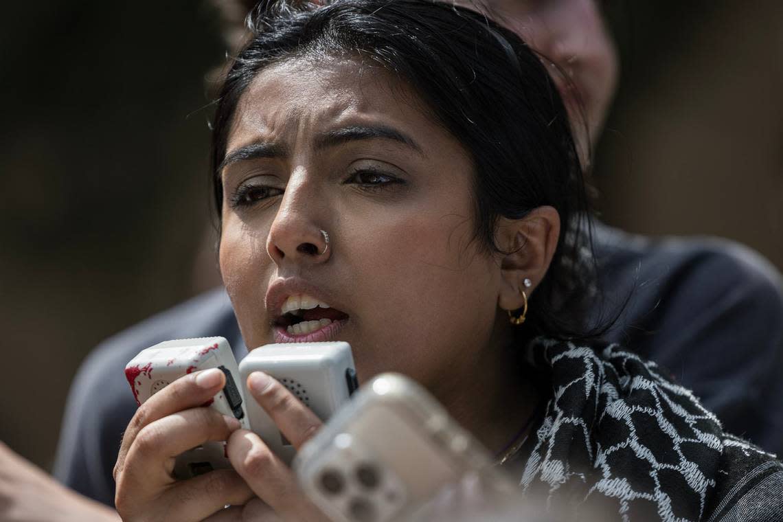 Talia Irsh, a student organizer with the Palestine Solidarity Committee at the University of North Texas, addresses the crowd gathered for the Campus Wide Walkout for Gaza at the campus Library mall on Tuesday, April 30, 2024.