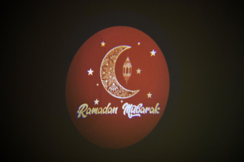 Yasmen Bagh has launched a company called Muslim Holiday Shop that sells outdoor decorations for the home to mark the Muslim holy month of Ramadan. One of Bagh's decorations, a projector, displays an image on Wednesday, May 1, 2019.