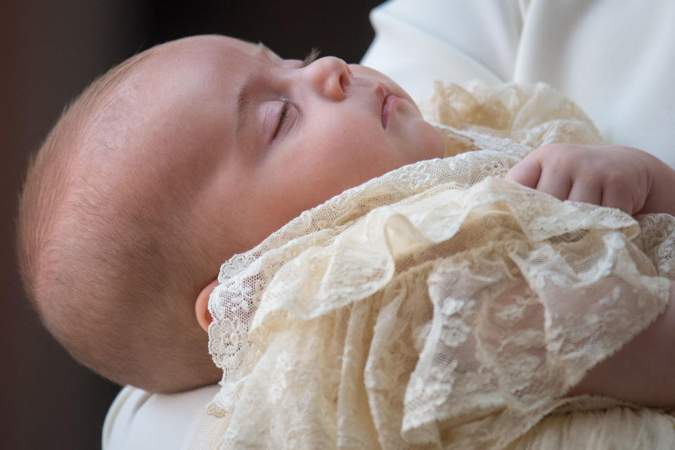 Prince Louis carried by his mother as they arrive for his christening at St James's Palace in London.