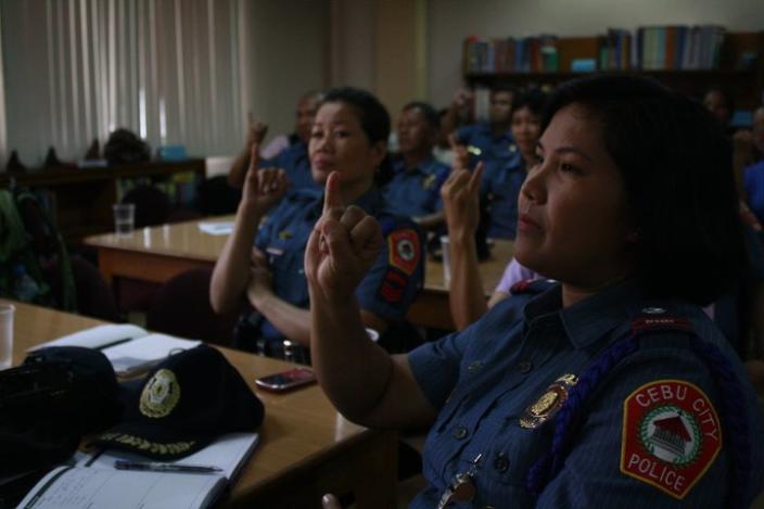 Cebu City police personnel learn sign language to help Deaf victims of sexual abuse.