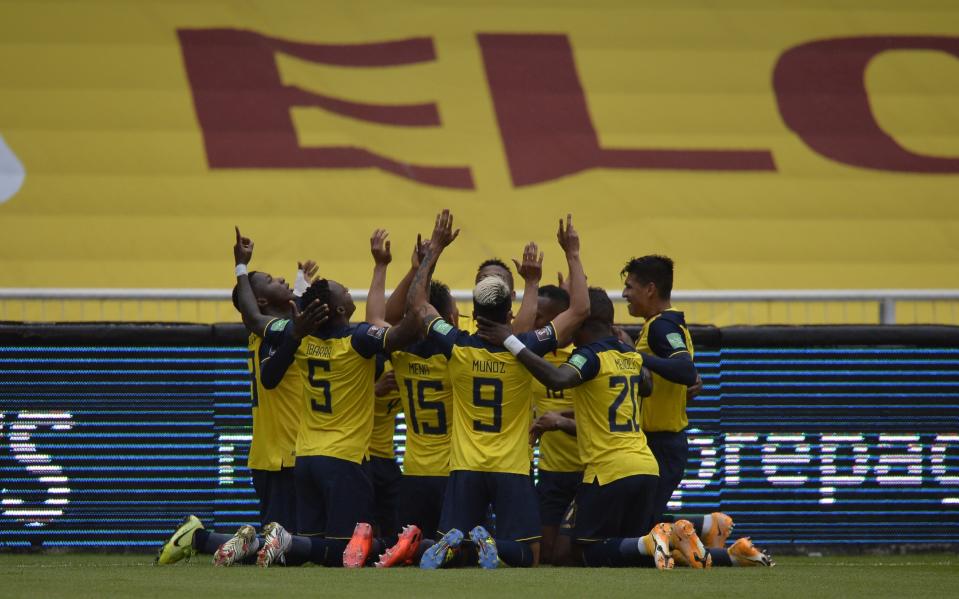 Ecuador's players celebrate after Roberto Arboleda scored his side's opening goal against Colombia during a qualifying soccer match for the FIFA World Cup Qatar 2022 in Quito, Ecuador, Tuesday, Nov. 17, 2020. (Rodrigo Buendia, Pool via AP)