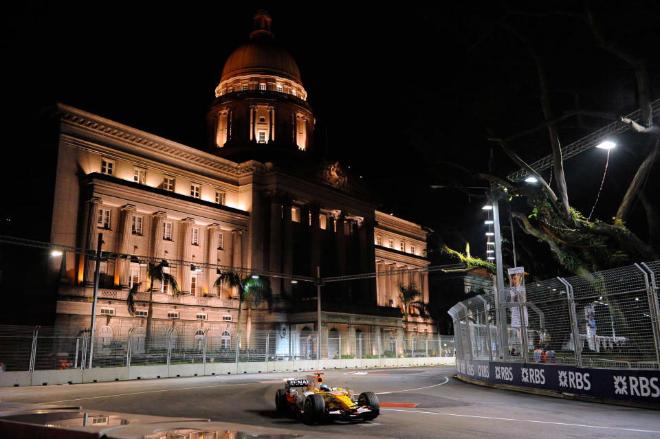 Before the storm: Fernando Alonso on his way to winning the controversial 2008 Singapore Grand Prix