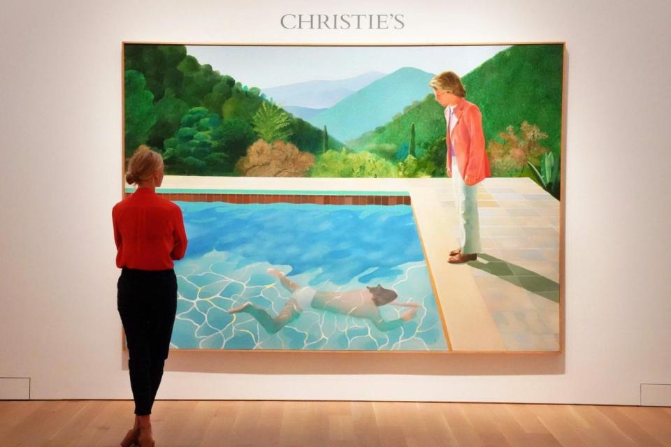 A woman looks at David Hockney's