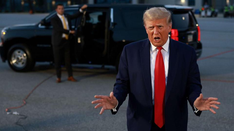 PHOTO: Former President Donald Trump speaks to the media at Atlanta Hartsfield-Jackson International Airport after surrendering at the Fulton County jail on Aug. 24, 2023 in Atlanta. (Joe Raedle/Getty Images)