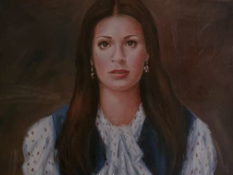 A portrait of Rachel in her house.