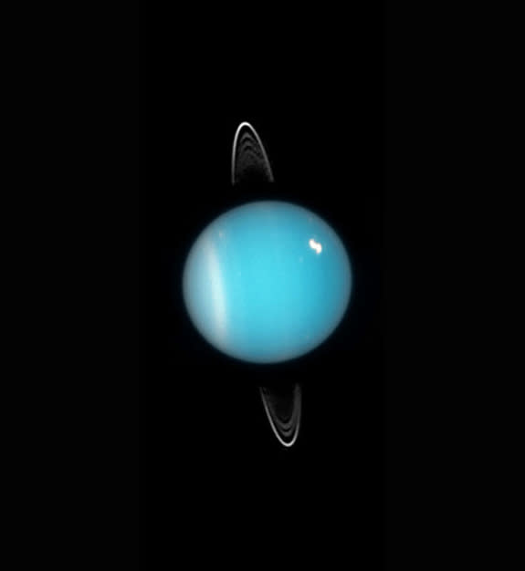 This image of Uranus was obtained in 2005 by the Hubble Space Telescope. Rings, southern collar and a bright cloud in the northern hemisphere are visible.