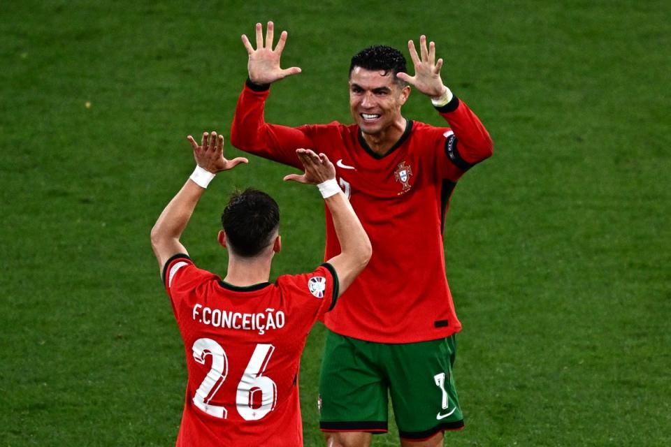 Ronaldo celebrates with match-winner Conceicao (AFP via Getty Images)