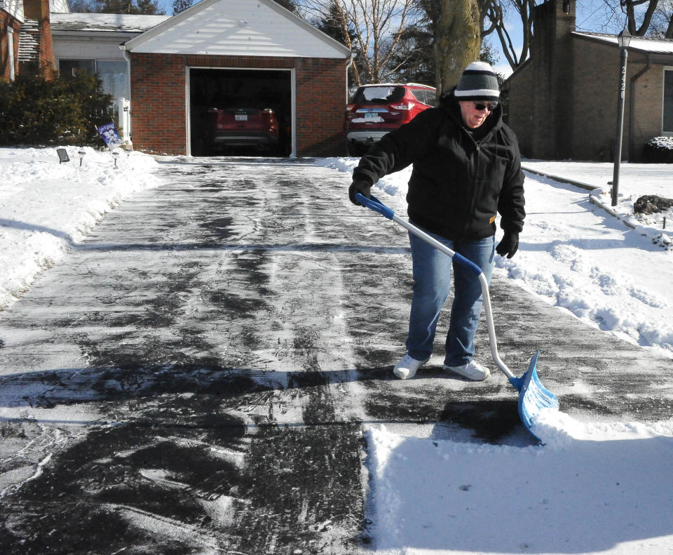 Barb Amos of Guerne puts the finishing touches on shoveling her driveway earlier this week when an inch or two of snow fell. The National Weather Services has issued a winter advisory through Friday evening for counties including Ashland, Crawford, Holmes, Knox, Marion, Richland and Wayne.