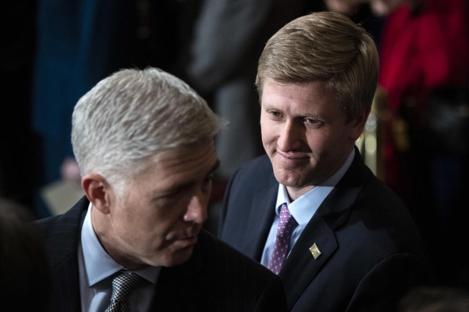 FILE - In a Monday, Dec. 3, 2018 file photo, Nick Ayers, right, listens as Supreme Court Associate Justice Neil Gorsuch waits for the arrival of the casket for former President George H.W. Bush to lie in State at the Capitol on Capitol Hill in Washington. President Donald Trump's top pick to replace John Kelly as chief of staff, Nick Ayers, is no longer expected to fill that role, according to a White House official. The official says that Trump and Ayers could not agree on Ayers' length of service. (Jabin Botsford/The Washington Post via AP, Pool, File)