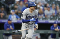 Los Angeles Dodgers' Trea Turner breaks from the batter's box after singling against Colorado Rockies starting pitcher German Marquez In the first inning of a baseball game Wednesday, Sept. 22, 2021, in Denver. (AP Photo/David Zalubowski)