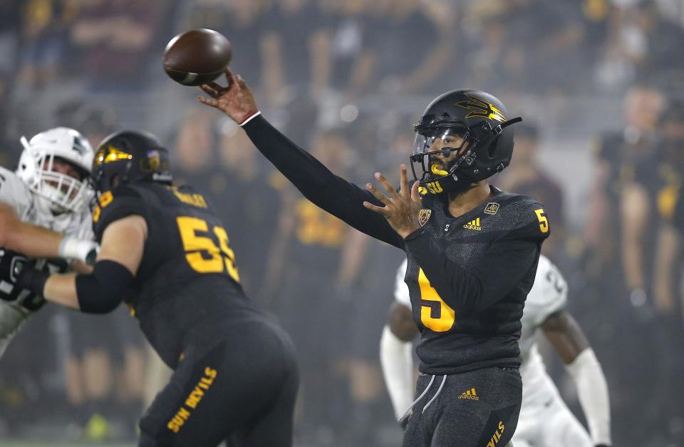 Arizona State quarterback Manny Wilkins (5) throws a pass against Michigan State during the first half of an NCAA college football game Saturday, Sept. 8, 2018, in Tempe, Ariz. (AP Photo/Ross D. Franklin)
