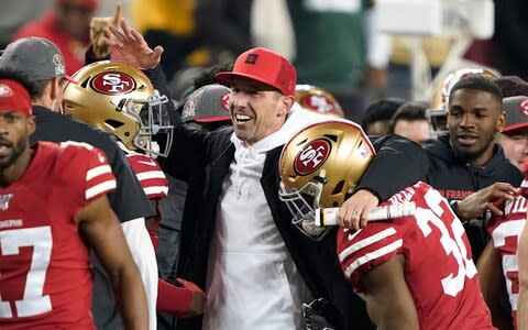 San Francisco 49ers head coach Kyle Shanahan, center, celebrates with players during the second half of the NFL NFC Championship football game against the Green Bay Packers Sunday, Jan. 19, 2020, in Santa Clara, Calif. The 49ers won 37-20 to advance to Super Bowl 54 against the Kansas City Chiefs.  - Credit: AP