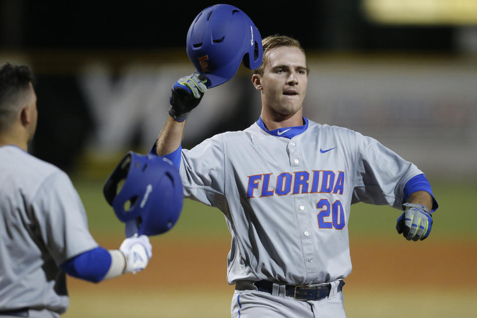 CORAL GABLES, FL - FEBRUARY 26: Peter Alonso #20 of the Florida Gators crosses home plate after hitting a two run home run against the Miami Hurricanes on February 26, 2016 at Alex Rodriguez Park at Mark Light Field in Coral Gables, Florida. Florida defeated Miami 5-0. (Photo by Joel Auerbach/Getty Images) 