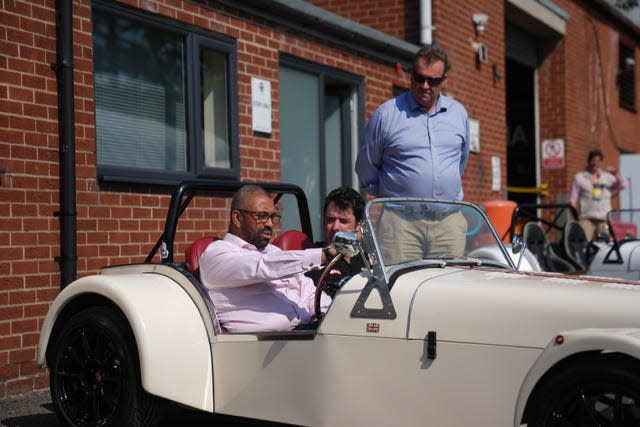 Home Secretary James Cleverly sits in a car during a visit to Great British Sports Cars in Ollerton, Nottinghamshire