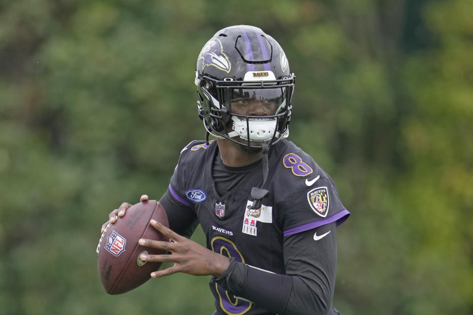 Baltimore Ravens quarterback Lamar Jackson (8) throws the ball during an NFL practice session in London, Wednesday, Oct. 11, 2023 ahead the NFL game against Tennessee Titans at the Tottenham Hotspur Stadium on Sunday. (AP Photo/Kin Cheung)