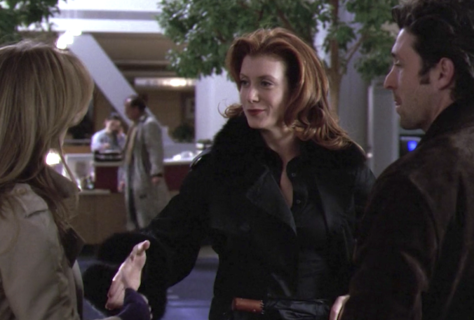 Addison reaches out her hand to shake Meredith's hand