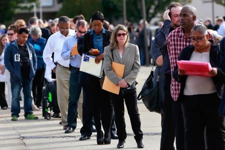 People wait in line to enter the Nassau County Mega Job Fair at Nassau Veterans Memorial Coliseum in Uniondale, New York October 7, 2014. REUTERS/Shannon Stapleton/File Photo