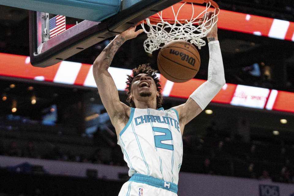 Charlotte Hornets guard LaMelo Ball dunks against the Indiana Pacers during the first half of an NBA basketball game in Charlotte, N.C., Wednesday, Oct. 20, 2021. (AP Photo/Jacob Kupferman)