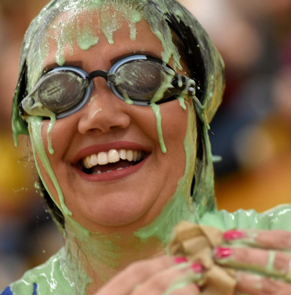 Sodt Elementary School Principal Tara Roe shares a big smile but cannot see after 38 students dumped slime onto her.