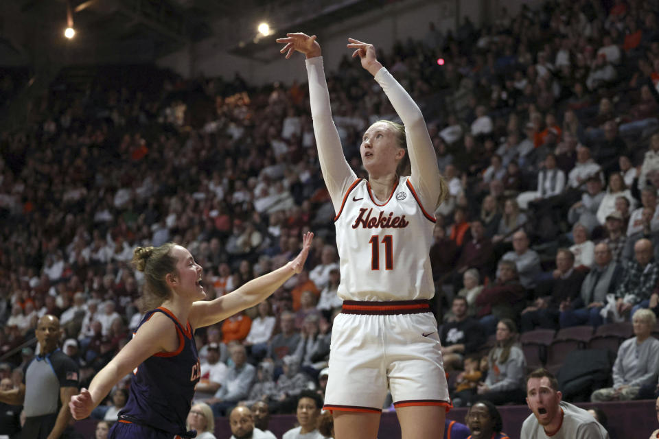 Virginia Tech's Matilda Ekh (11) shoots a 3-point basket in the final moments of the first half of an NCAA college basketball game against Clemson in Blacksburg, Va, Sunday, Jan. 21, 2024. (Matt Gentry/The Roanoke Times via AP)