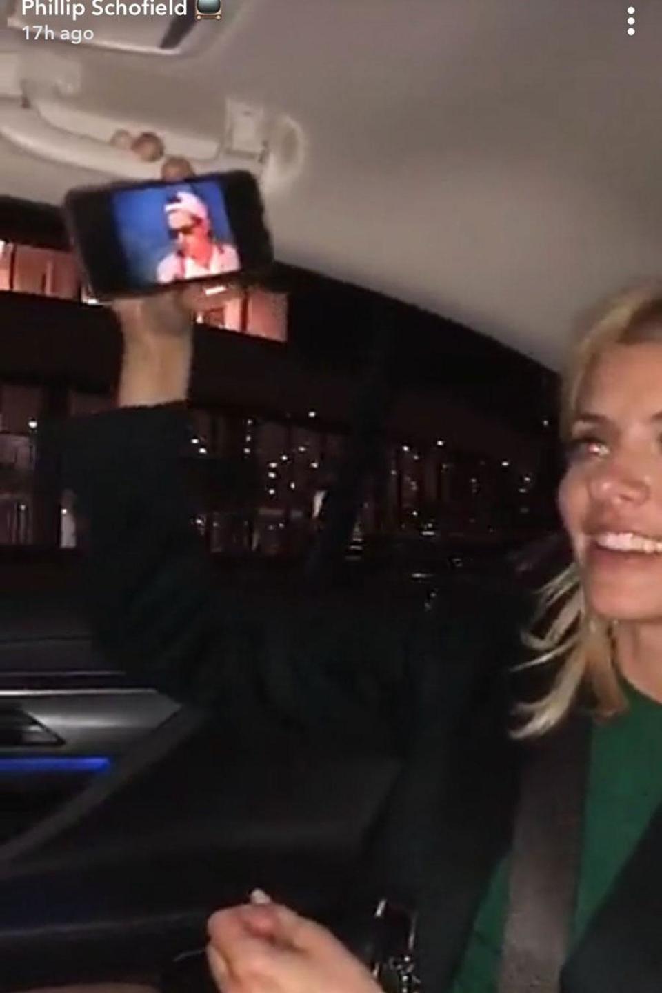 Holly Willoughby singing along to a video in the cab home from Davina McCall's party. (Snapchat/Phillip Schofield)