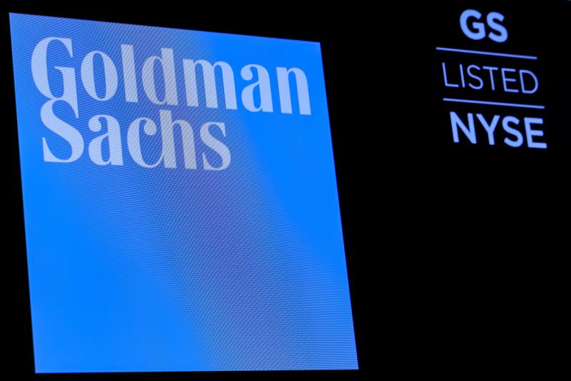 FILE PHOTO: FILE PHOTO: The ticker symbol and logo for Goldman Sachs is displayed on a screen on the floor at the NYSE in New York