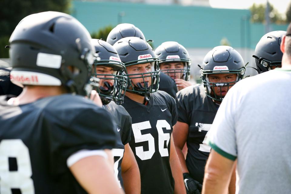 Sheldon football players listen to coaching staff during practice with the team Wednesday, Aug. 23, 2023, at Sheldon High School in Eugene.