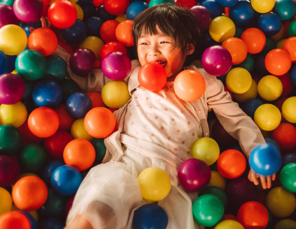 kid in a ball pit