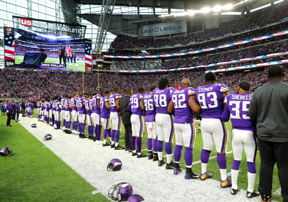 <p>Minnesota Vikings players link arms during the national anthem before the game against the Detroit Lions on October 1, 2017 at U.S. Bank Stadium in Minneapolis, Minnesota. (Photo by Adam Bettcher/Getty Images) </p>