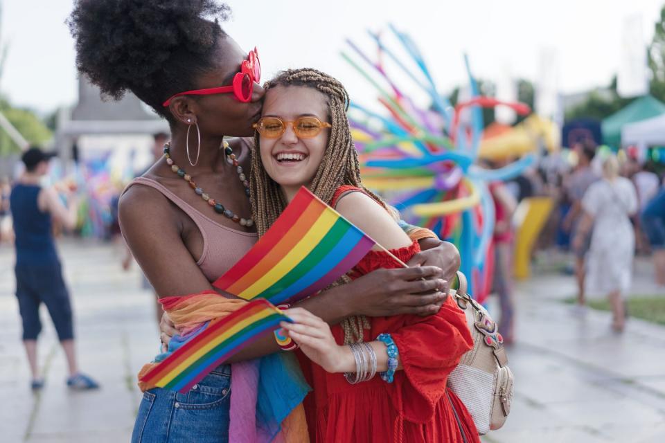 Girls kissing during Pride month event