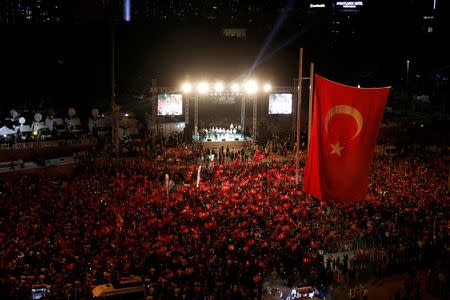 Supporters of Turkish President Tayyip Erdogan gather during a pro-government demonstration on Taksim Square in Istanbul, Turkey, July 18, 2016. REUTERS/Alkis Konstantinidis