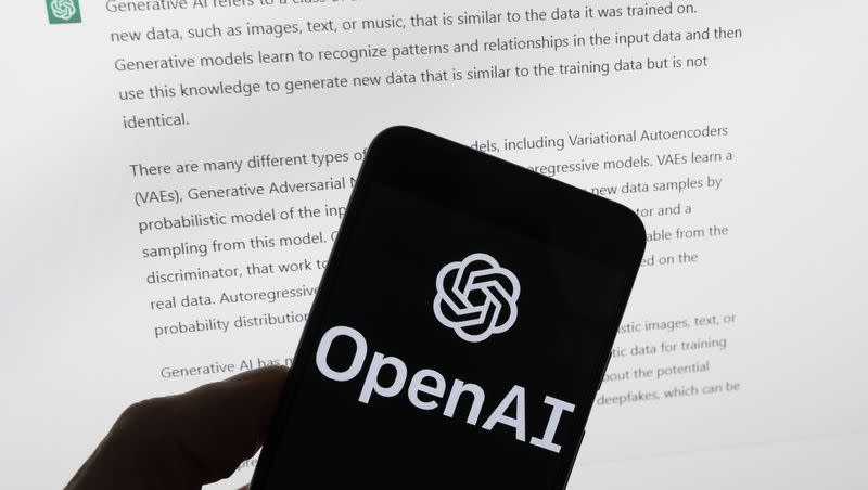 The OpenAI logo is seen on a mobile phone in front of a computer screen displaying output from ChatGPT, Tuesday, March 21, 2023, in Boston. Are tech companies moving too fast in rolling out powerful artificial intelligence technology that could one day outsmart humans? That is the conclusion of a group of prominent computer scientists and other tech industry notables who are calling for a six-month pause to consider the risks. Their petition published Wednesday, March 29, 2023, is a response to San Francisco startup OpenAI’s recent release of GPT-4.