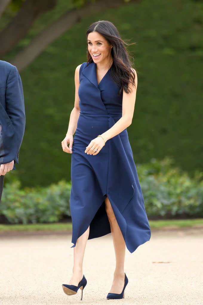 <p>Harry and Meghan visited Melbourne on day three of their royal tour. For a walkabout and reception hosted at Government House, <a href="https://www.townandcountrymag.com/style/fashion-trends/a23878629/meghan-markle-dress-melbourne-australia-royal-tour/" rel="nofollow noopener" target="_blank" data-ylk="slk:the Duchess wore a navy dress;elm:context_link;itc:0;sec:content-canvas" class="link ">the Duchess wore a navy dress</a> by Dion Lee with a pair of pumps.</p>