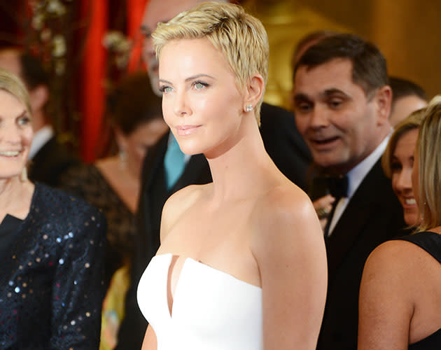 Actress Charlize Theron arrives at the Oscars. (Credit: Getty)