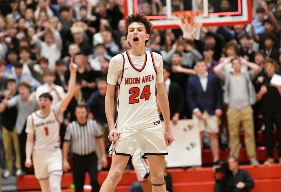 Moon’s Aiden Reesman celebrates the Tiger’s 67-65 win over Thomas Jefferson during Monday’s WPIAL Class 5A semifinal game at Peters Township High School.