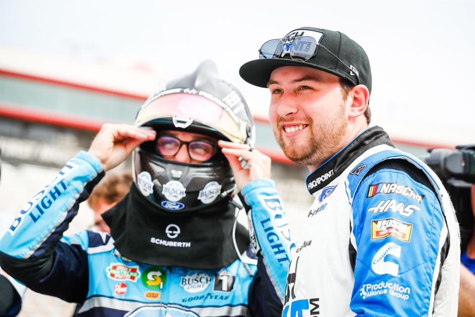 Mitchell's Chase Briscoe (right) shares a light moment with SHR Racing teammates Kevin Harvick.