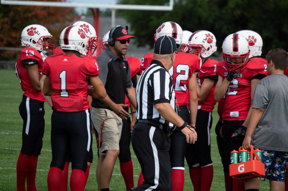 Litchfield gets the game plan from head coach Michael Langhann