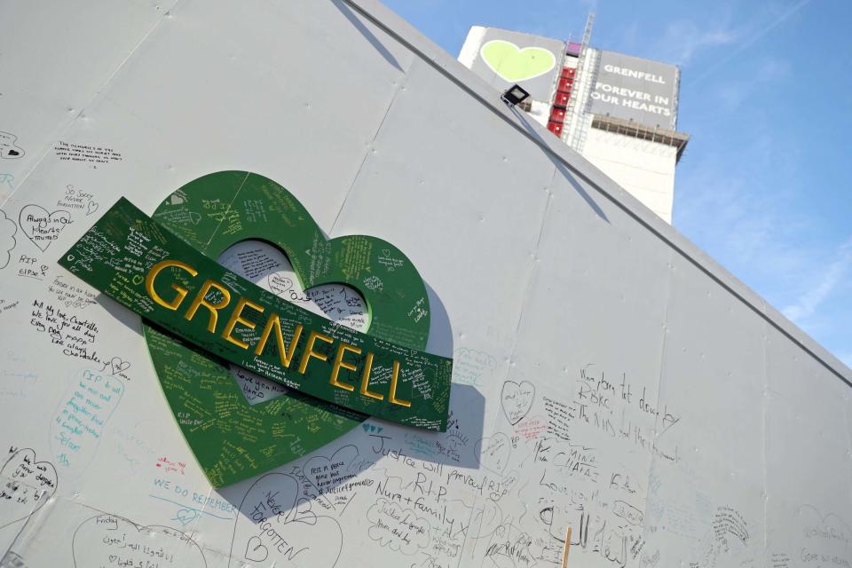 Tribute messages on a wall near the Grenfell Tower. (PA)